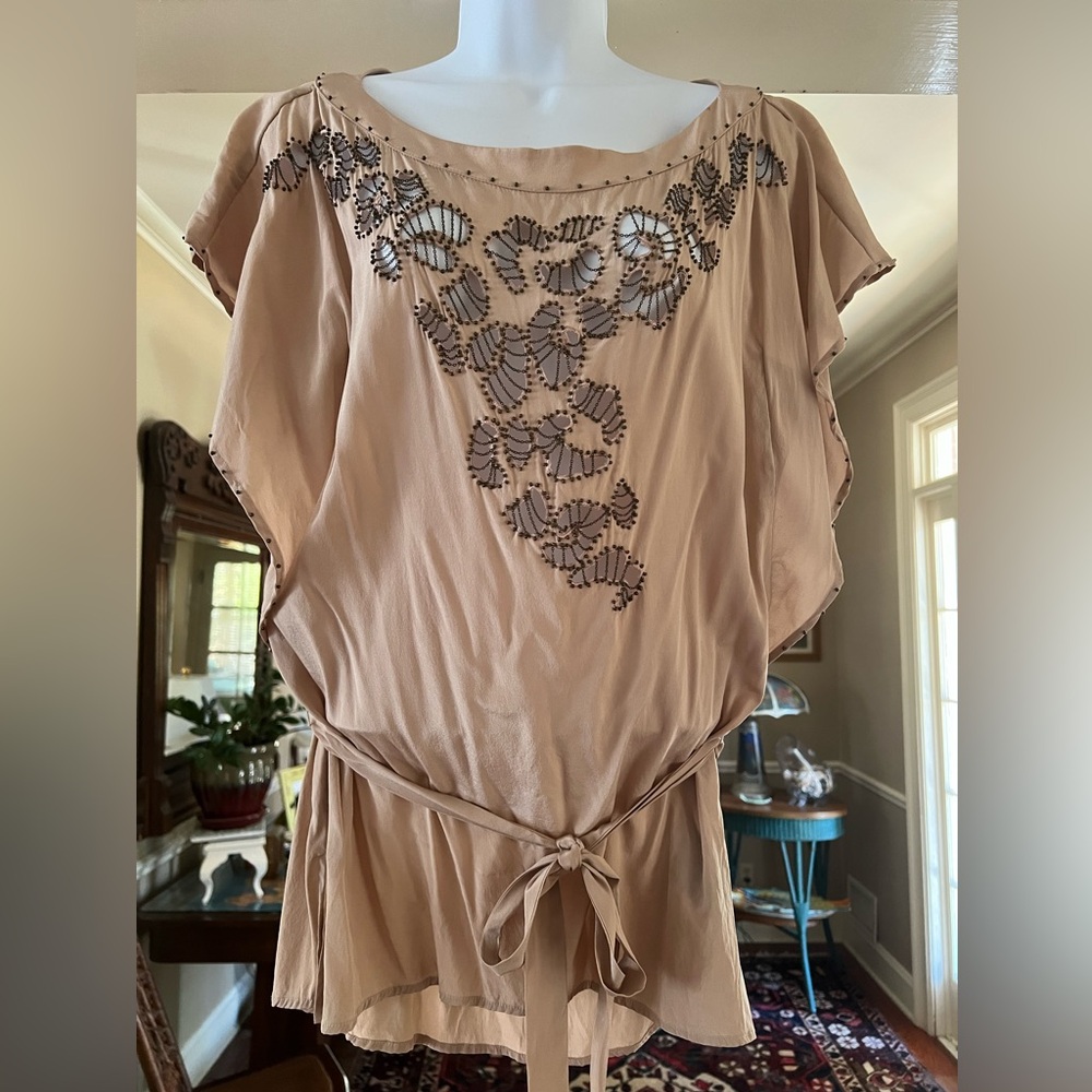 bebe blush-colored blouse with tied belt, silk with beads and cutout work.